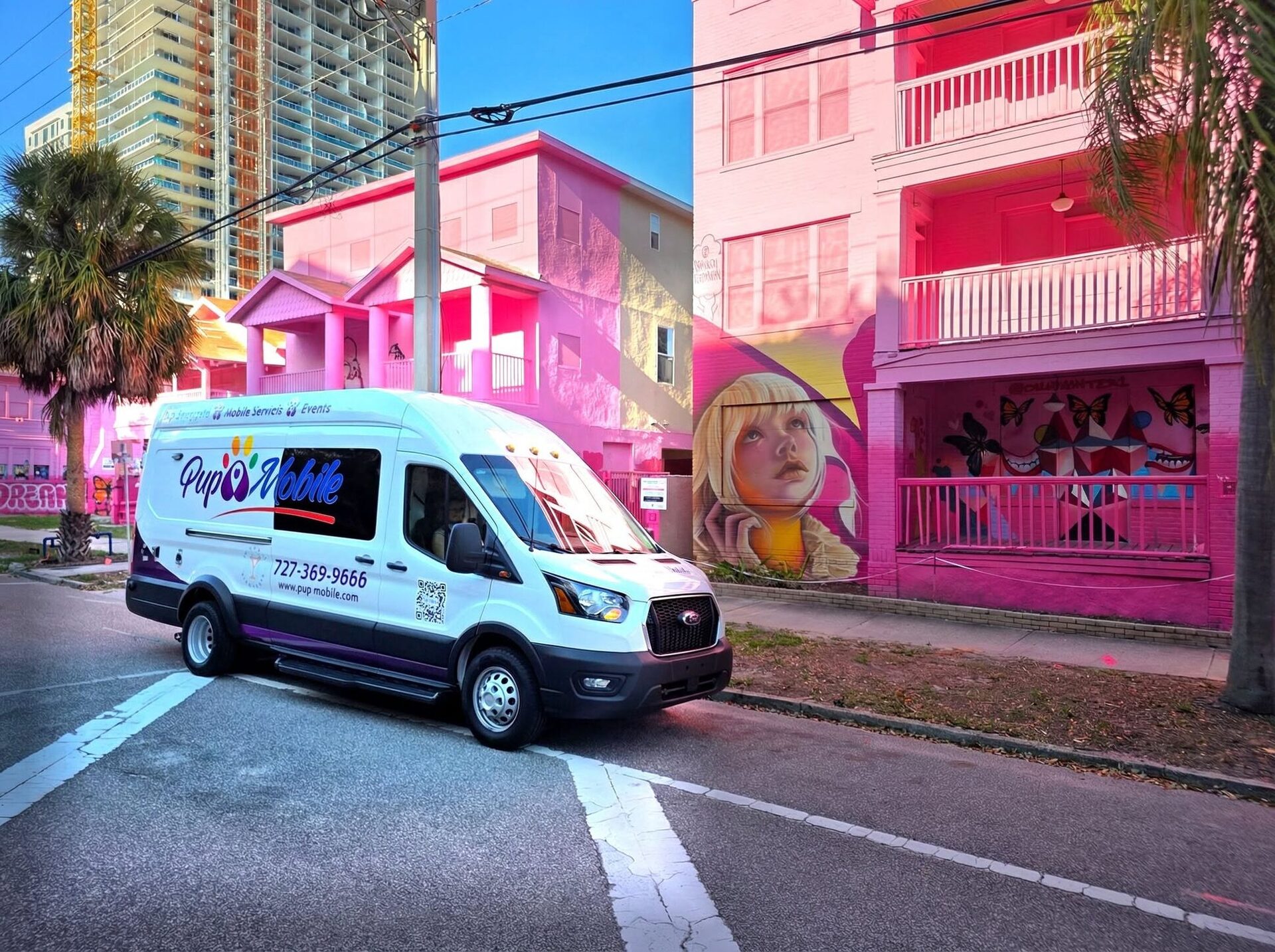 The Pup Mobile van on a hot-pink St. Pete street